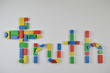 cross and word truth of colorful toy wooden blocks