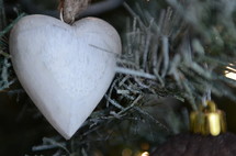 wooden heart ornament on a Christmas tree 