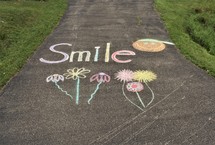 smile in sidewalk chalk 