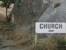 sign point the way to a church 