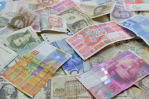 pile of various currency 
