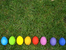 Multicolored Easter eggs in the grass. 