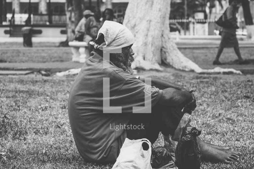 homeless man in a park 