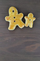 baked raisin bread in the shape of a gingerbread man 