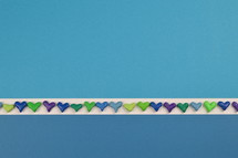 heart shapes border on a blue background 