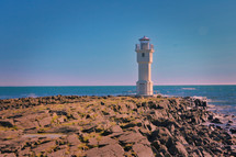 lighthouse on a rocky shore 