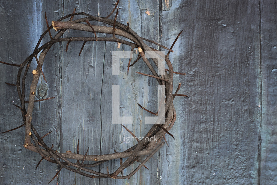 crown of thorns on wood background 