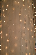 strings of lights hanging on a wall 