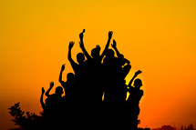 silhouettes of children at sunset in Africa 