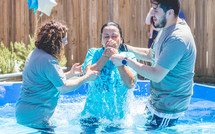 a young woman being baptized 