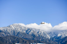 plane flying over mountains 
