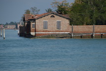 brick house at the edge of the sea 