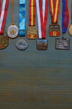 medals on cyan wooden background