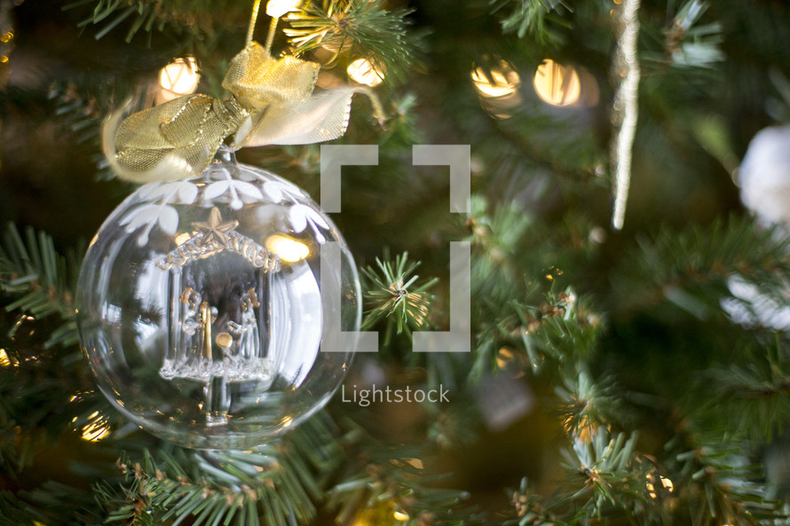clear glass ornament ball on a Christmas tree