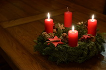 Three candles are burning at the Advent wreath for the third advent. 
advent, candle, Christmas, candles, four, three, two, one, lit, light, bright, burn, burning, wreath, birth, Jesus, born, waiting, wait, flame, flames, red, arrive, arriving, come, coming, await, await arrival, arrival, anticipated, anticipate, anticipating, expected, expect, expecting, awaited, long-awaited, hope, hoping, desiderated, longed, longed for, long-yearned-for, crave, desire, long, desiderate, longing, craving, desiring, fir, fir branch, branch, fir-bough, cone, fir cone, pine, pine cone, quiet, time, Christmas story, nativity, nativity story, countdown, count, third, third advent, inbetween
