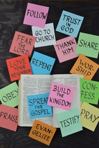 opened Bible with messages on sticky notes 