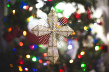 cross ornament on a Christmas tree