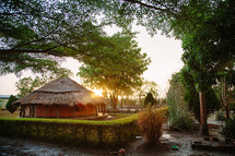 straw thatched roof huts in Africa, after a rainstorm