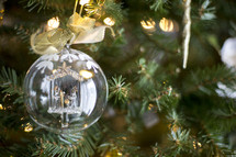 clear glass ornament on a Christmas tree 
