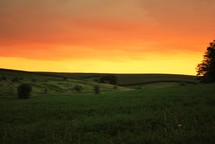 sunset over rolling hills 