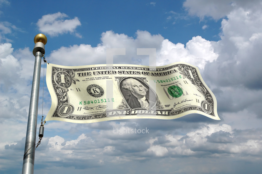 A one dollar bill as a flag on a flagpole against the sky.
