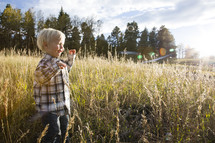 boy toddler running in a field 