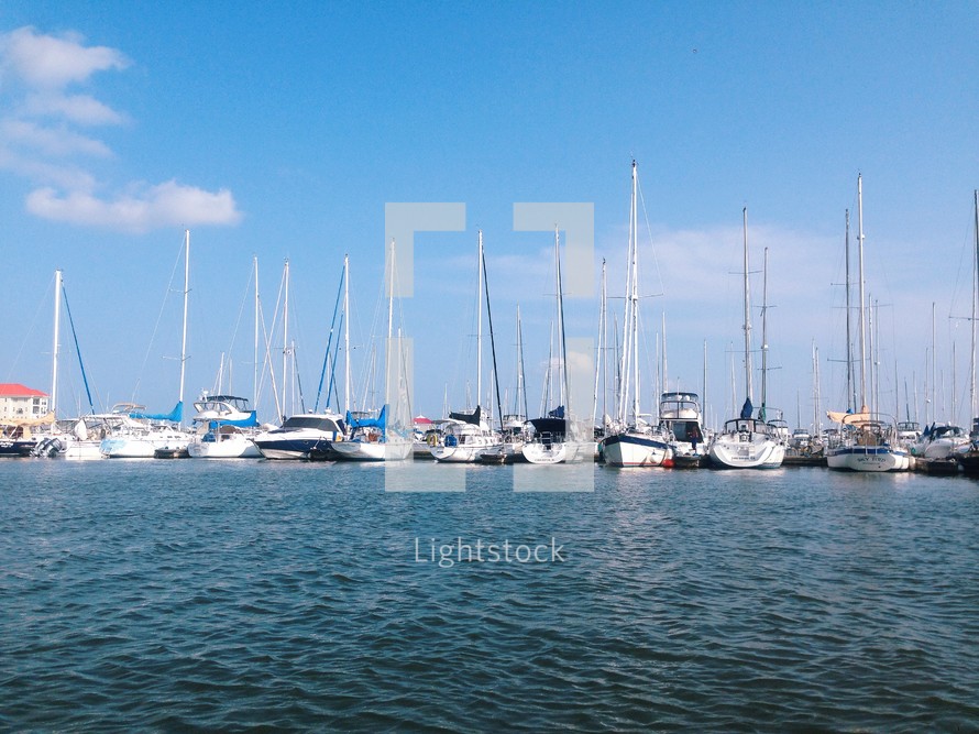 sailboats and yachts in a marina 