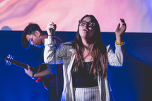worship leader holding a microphone 
