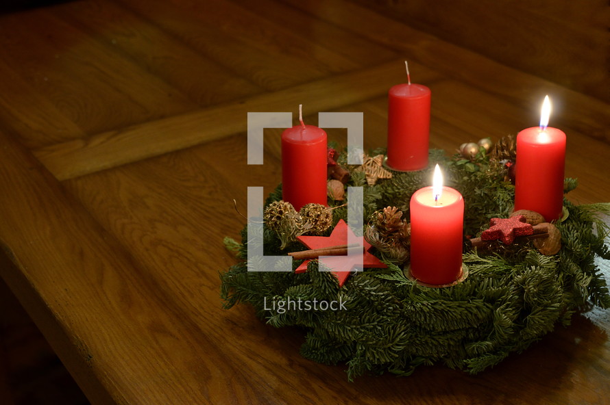 two candles burning on an advent wreath for the second advent. 