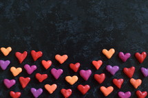 border of hearts on a black background 
