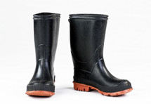 A pair of black rubber rain boots.