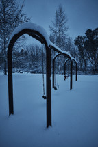 a playground covered in snow