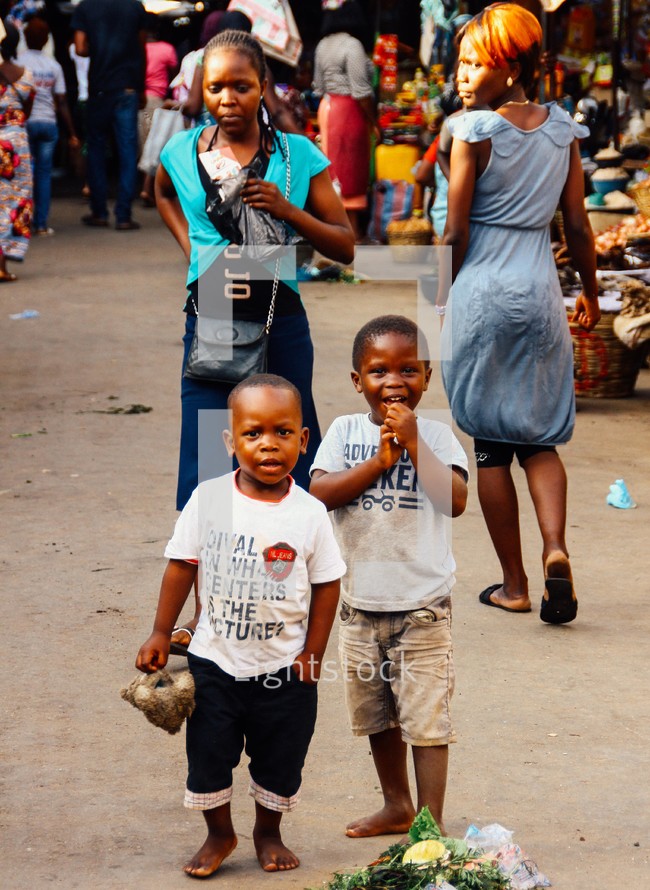 women and children in a market 