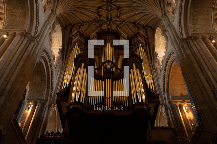 Church organ inside Norwich Cathedral, large pipe organ, beautiful religious architecture