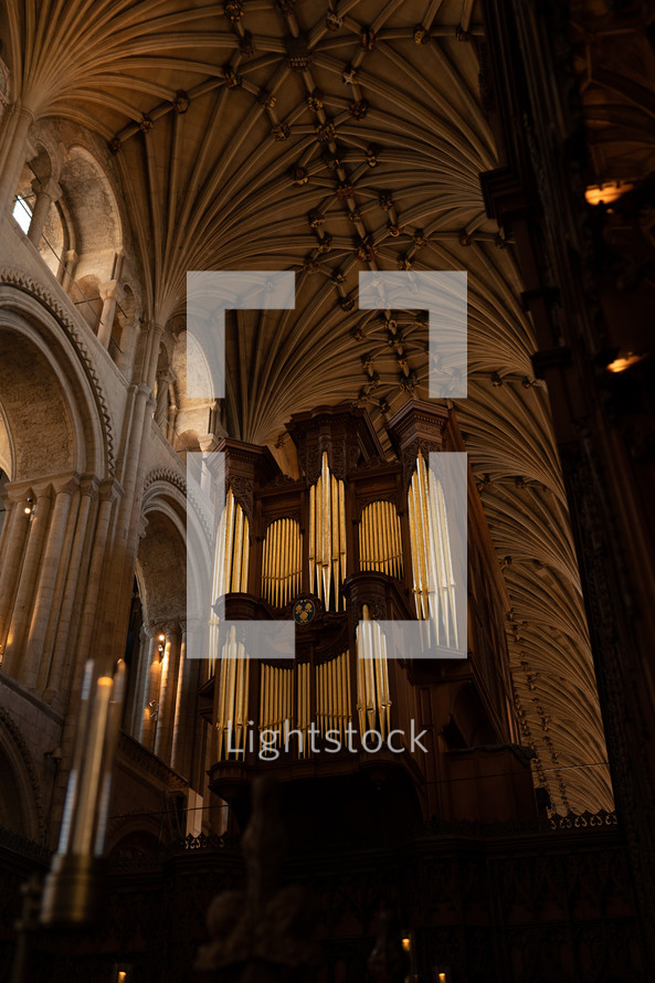 Church organ inside Norwich Cathedral, large pipe organ, beautiful religious architecture