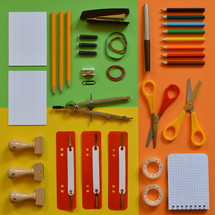 School supplies on colorful paperboard