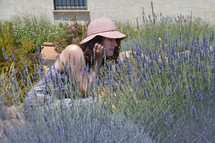 a woman in a field of lavender 