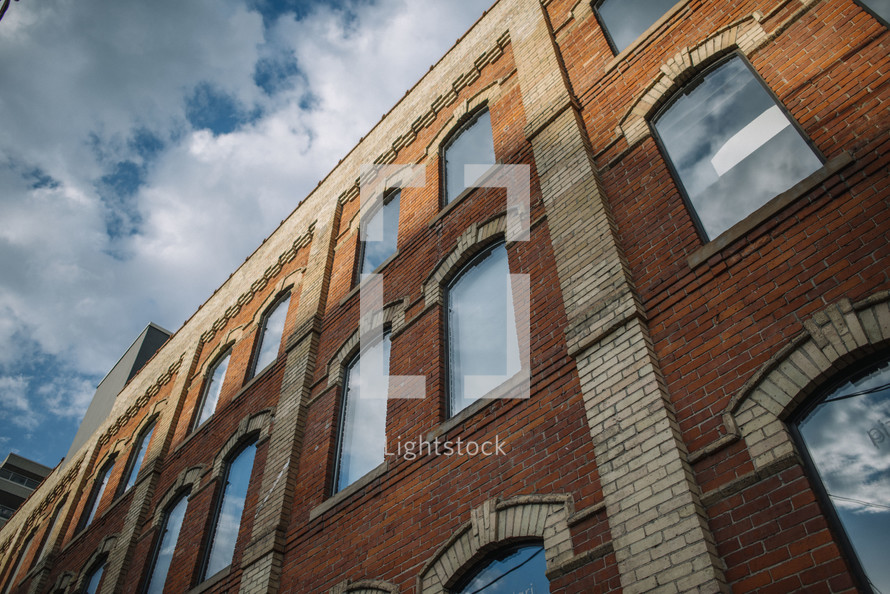 windows on the side of a brick building 
