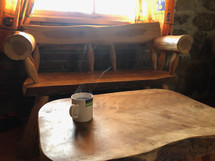 steaming cup of coffee in a cabin 