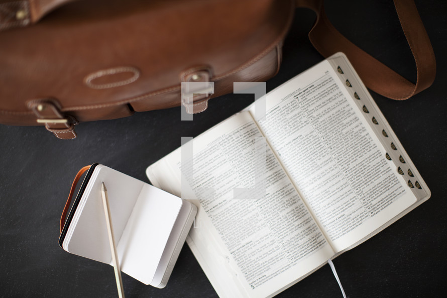 open Bible, journal, purse 