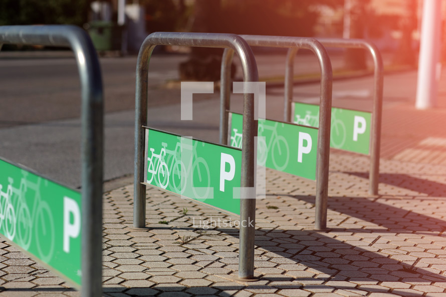 parking for bicycles and skateboards based on a tubular structure of stainless steel bars. selective focus. High quality photo.