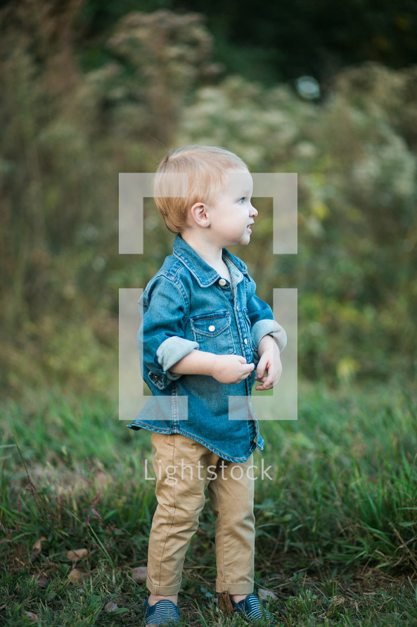toddler boy in a denim shirt 