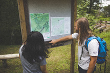 reviewing maps before hiking nature trails 