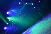 stage lights over a drum set
