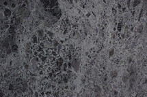 natural dark gray granite stone surface as neutral background