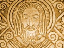 A stone carving relief of Jesus Christ from a Mayan art carving. 
