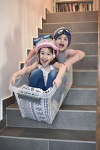 kids having fun on stairs in a bucket 