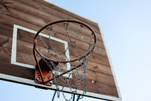 close up of basketball hoop. Basketball court outdoors, metal net and backboard for basket ball game outside. Recreational sport equipment on streetball field alfresco, playground on street