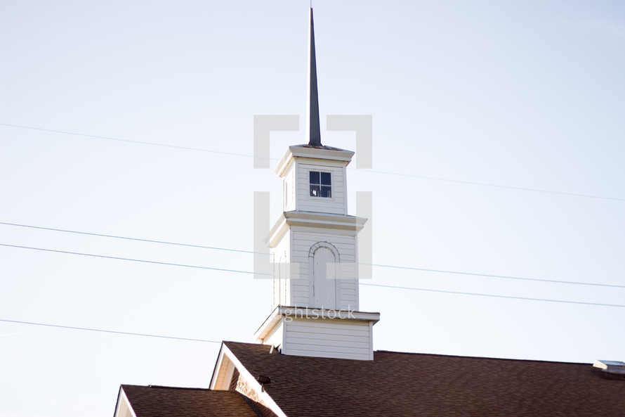white steeple on a church roof 
