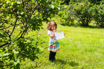 girl picking blueberries 